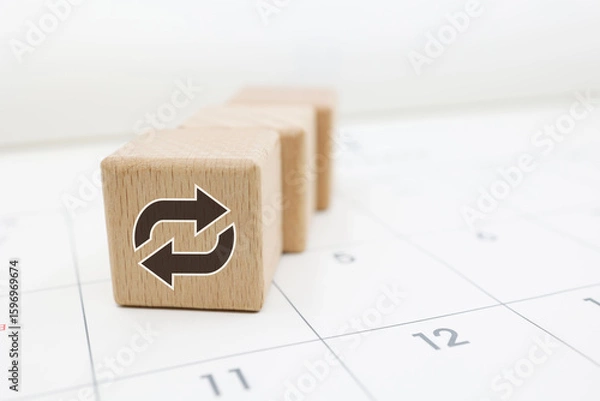 Fototapeta 繰り返しスケジュールの概念を示すカレンダーと木のブロック
