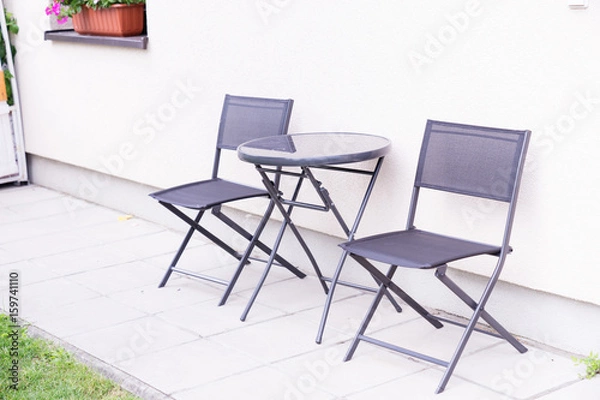 Fototapeta Two chair and table in hause terrace.