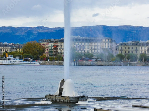 Fototapeta Base of the Geneva water jet with the lake and the city of Geneva, Switzerland in the background