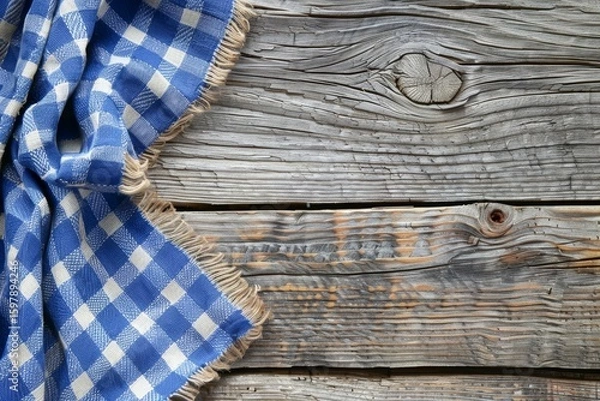 Obraz Rustic wooden surface featuring a blue checkered napkin with ample space for text or design