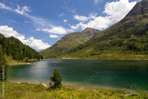 Fototapeta Staller Saddle is a high mountain pass in the Eastern Alps, connecting the Defereggen Valley in East Tyrol with the Antholz Valley in South Tyrol. The pass forms the border between Austria and Italy