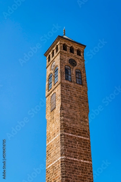 Fototapeta Sarajevo Clock Tower located beside Gazi Husrev-beg Mosque. The clock shows lunar time.