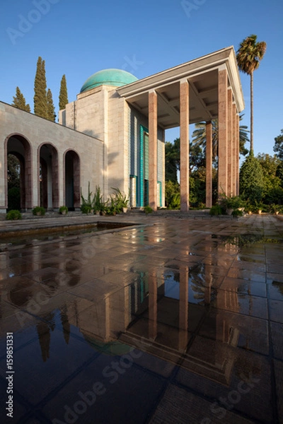 Fototapeta Tomb of Saadi in Shiraz Reflected on Wet Floor on a Sunny Day