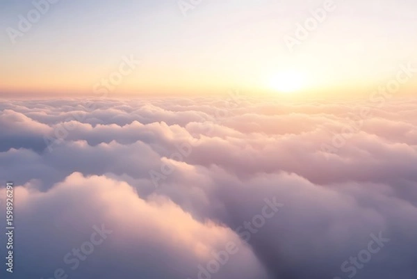 Fototapeta Aerial View of Clouds at Sunset with Warm Sunlight Above the Skies