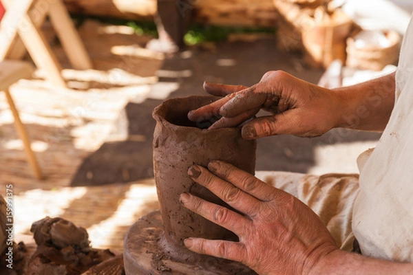 Fototapeta Making a jug on a ceramics jigger