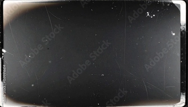 Fototapeta Vintage film frame with scratches and dust. Retro screen overlay texture for an old movie effect. Grunge cinematic background.