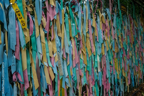 Obraz Prayer ribbons tied to a chain link fence, symbolizing hope for reunification between North and South Korea, inside a tourist area of the Korean DMZ in Paju, Gyeonggi-do, South Korea
