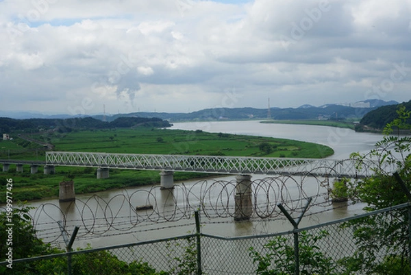 Obraz Looking towards South Korea from inside the Korean DMZ, behind a barbed wire fence in Paju, Gyeonggi-do, South Korea