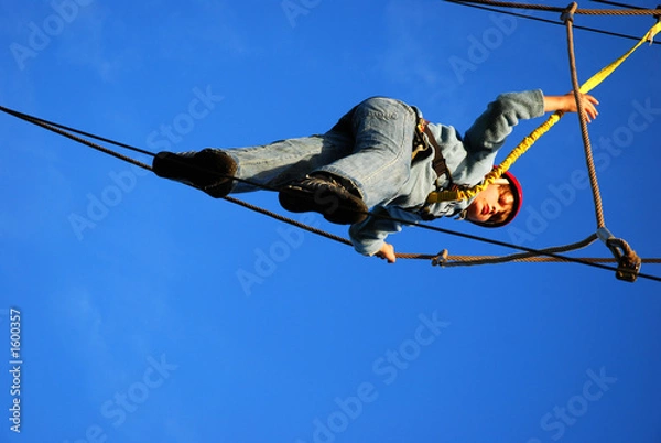 Obraz boy standing on a steel wire