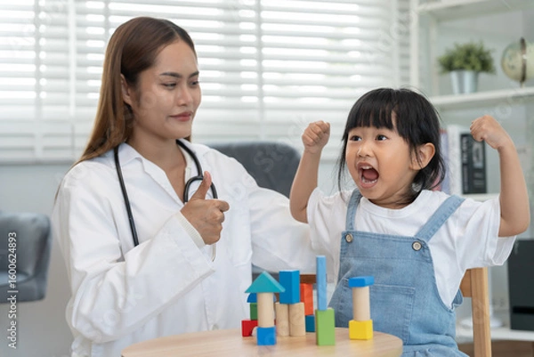 Fototapeta Pediatricians are checking the children development according to the appropriate age, doctors encourage the child to do activities, IQ, EQ, age appropriate learning activities and promotion, expect