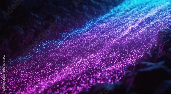 Obraz Stream of glowing blue  purple particles winding through rocky terrain