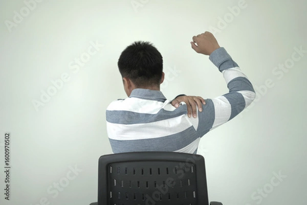 Fototapeta Man having tensed muscles fatigued, neck, shoulder, back, wrist and arm pain during work long time in office, due to fibromyalgia, rheumatism, scapular pain, office syndrome and ergonomic concept.