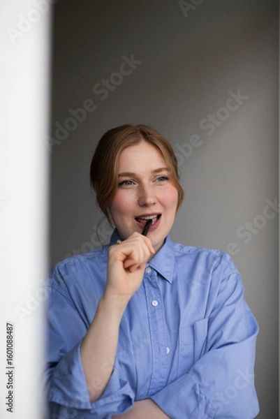 Obraz portrait of a young man talking on phone