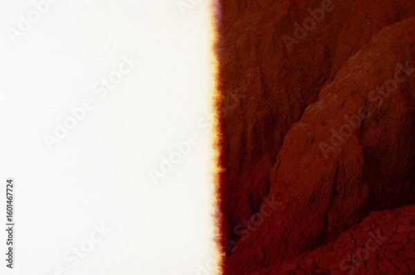 Fototapeta Bold depiction combining stark contrasts between a light 35mm film burn and red earthy textures in a desert. Natural film effect.