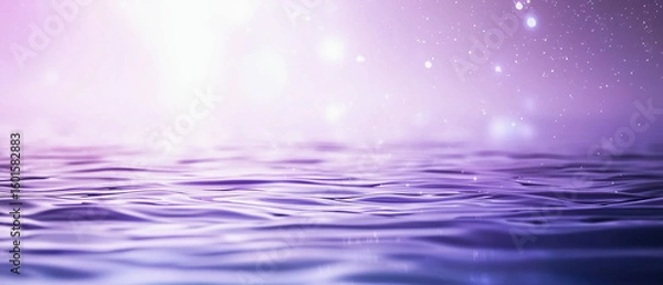 Fototapeta A serene close-up of purple-hued water ripples with soft glowing lights and a dreamy, sparkling background.