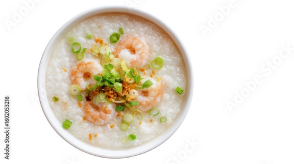 Fototapeta Bowl of rice porridge topped with shrimp and green onions, isolated on white background.