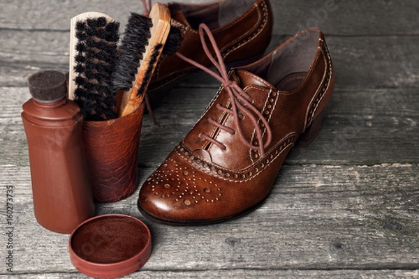 Obraz Shoe wax and brushes on wooden surface