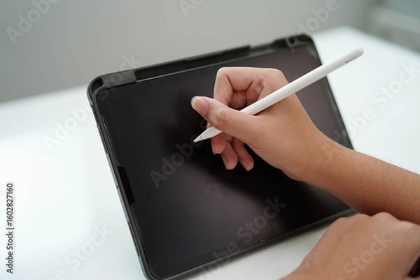 Fototapeta Teenage using tablet for communication, search data internet website to learn.