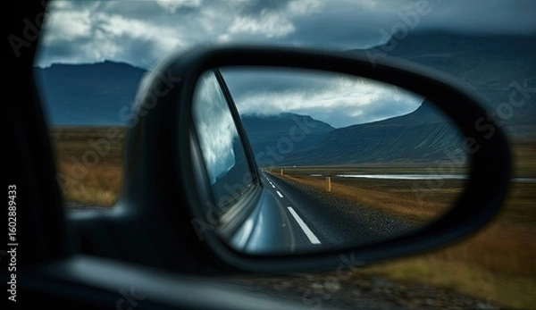 Fototapeta Scenic view reflected in a car mirror