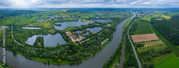 Fototapeta Aerial view of the village Remerschen and the river Mosel in Germany on a sunny spring day