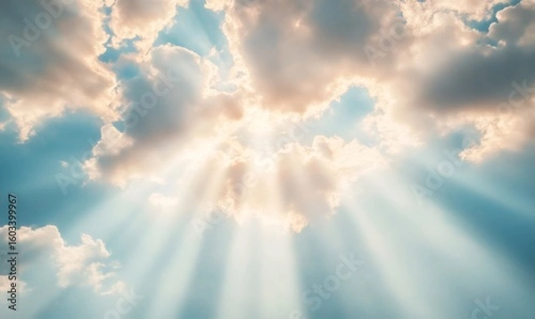 Fototapeta Radiant sunlight penetrating soft clouds against deep blue sky, revealing celestial luminosity and serene atmospheric depth, symbolizing natural harmony and quiet inspiration