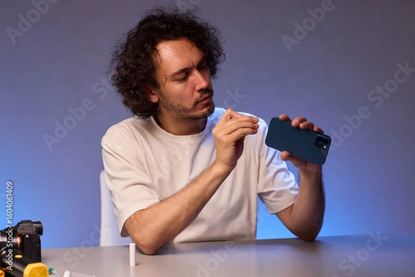 Fototapeta The Innovative Smartphone Cleaning Device is Being Demonstrated During Use and Functionality
