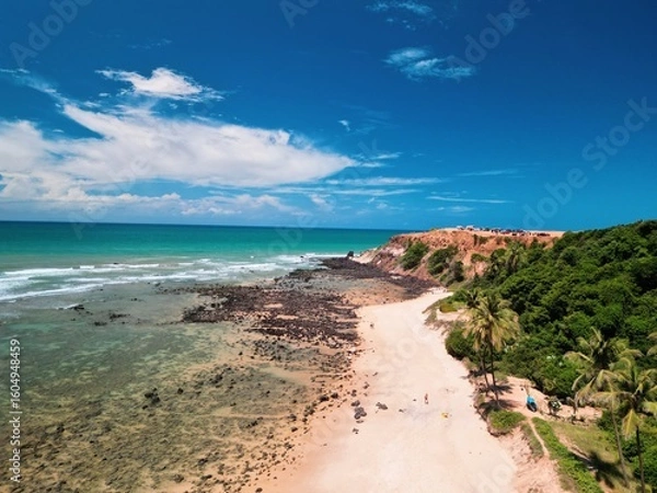 Fototapeta Aerial view of Praia da Pipa and Chapadão cliffs in Pipa, Rio Grande do Norte, Brazil, showing paradise beaches, blue sea, and dramatic coastline – perfect summer destination