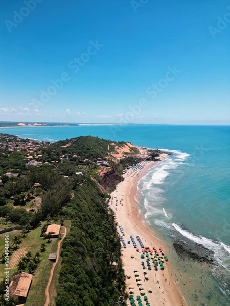 Fototapeta Aerial view of Praia da Pipa and Chapadão cliffs in Pipa, Rio Grande do Norte, Brazil, showing paradise beaches, blue sea, and dramatic coastline – perfect summer destination
