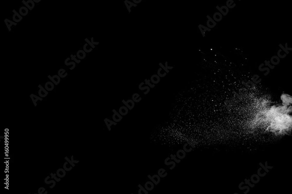 Fototapeta Powder explosion. Closeup of  white particle explosion isolated on black background