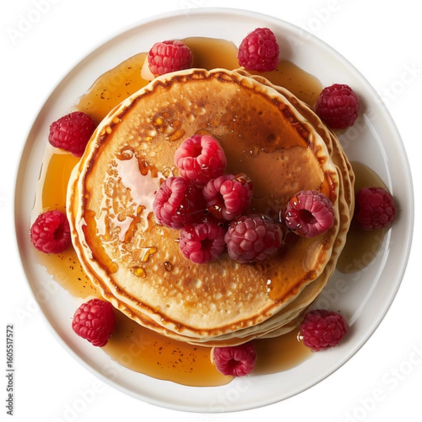 Fototapeta Stack of Golden Pancakes Topped with Fresh Raspberries and Drizzled with Syrup