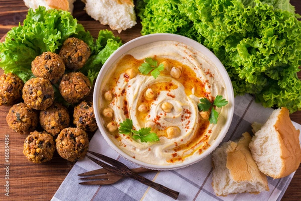 Fototapeta Hummus, falafel and chickpea served with salad and pita
