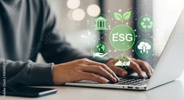 Fototapeta Person typing on laptop with glowing esg icons representing environmental social and governance principles
