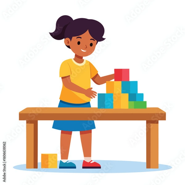 Fototapeta A young girl with dark hair is building a tower of colorful blocks on a wooden table, smiling as she plays.