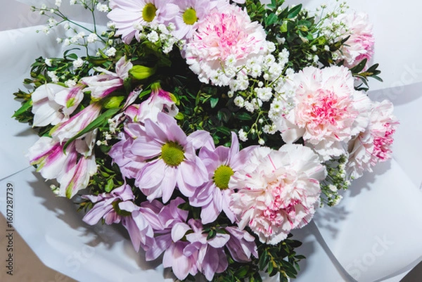Obraz A luxurious bouquet of carnations, daisies, and gypsophila. Bunch of many colorful flowers. Floristry and floral design concept. Floral texture