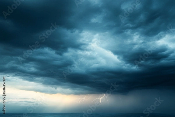 Fototapeta Stormy sky filled with dark clouds and flashes of lightning