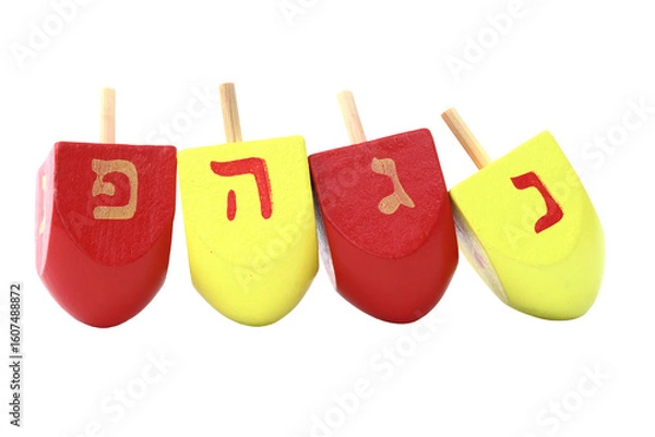Obraz Colorful Hanukkah dreidels isolated on white. The dreidels are ordered: Nun, Gimel, He, Pe (Nes Gadol Haya Po)