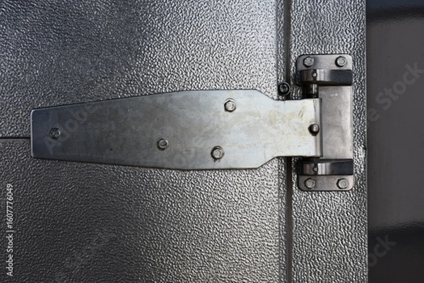 Obraz Large external hinge on industrial freezer door.