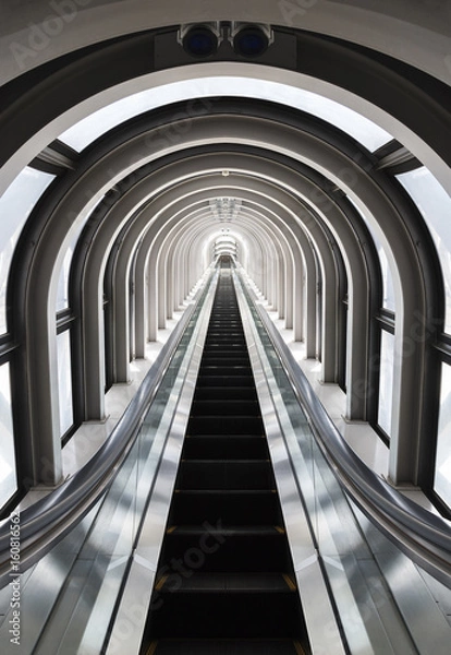 Fototapeta Futuristic tunnel and escalator of steel and metal, interior view. Futuristic background, business concept