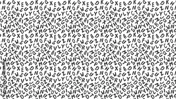 Fototapeta Monochrome background featuring a chaotic arrangement of random letters scattered across the surface