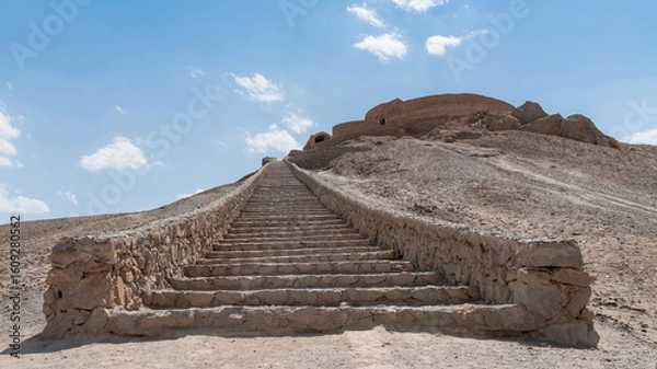 Fototapeta The ancient Zoroastrian Towers of Silence in Yazd, elevated circular structures on arid hills, under a vast sky