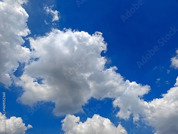 Fototapeta blue sky with white clouds in sunny summer day