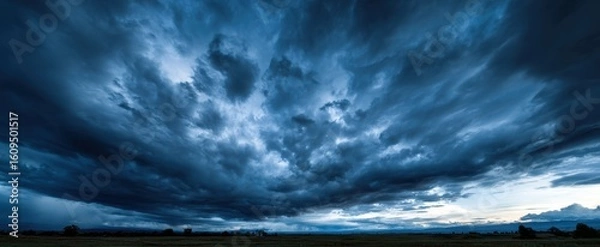Obraz The Dramatic Clouds Casting Shadows Over a Serene Landscape