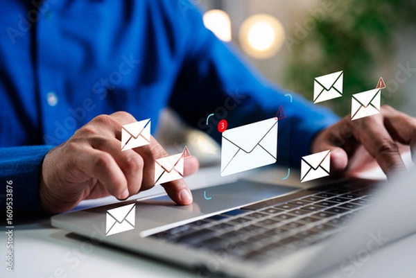 Fototapeta A Businessman working on a laptop open an email with triangle caution warning sign for notification error and maintenance concept, network security, computer virus detected, personal data protection.