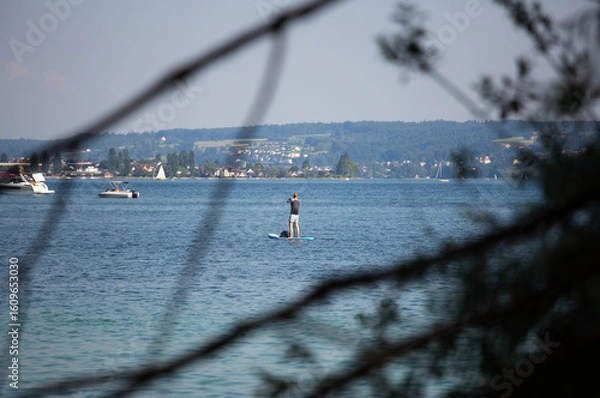 Fototapeta unrecognisable person on sup board on the lake