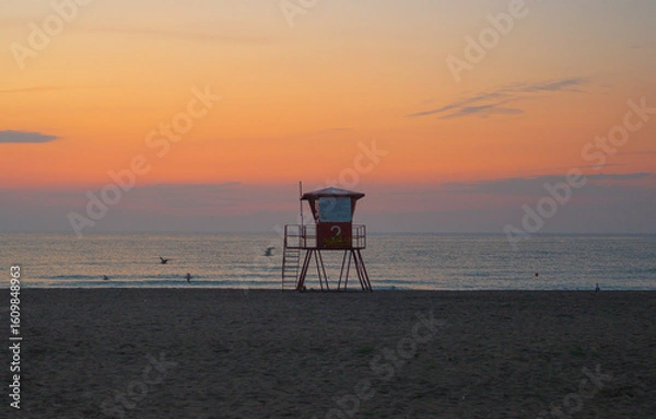 Fototapeta The lifeguard's gazebo on the beach. The beach in the early hours of the morning.