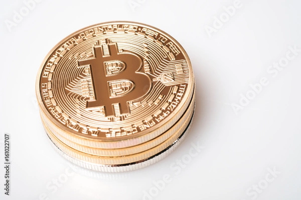 Obraz Stack golden bitcoin isolated on white background