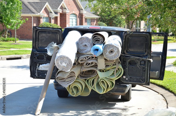 Fototapeta Van loaded with carpet and padding rolls for flooring installation