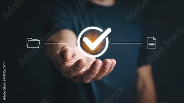 Fototapeta Hand holding illuminated checkmark symbolizing approval, success, and data verification concept