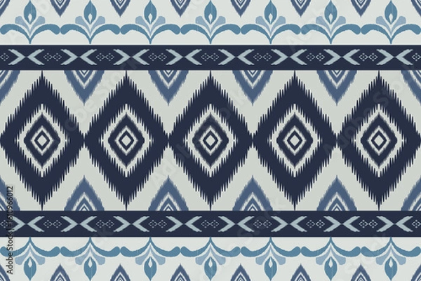Fototapeta Seamless indigo ikat patterns in ethnic tribal style, featuring geometric diamond shapes and woven texture in blue tones.