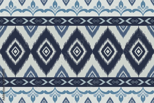Fototapeta Seamless indigo ikat patterns in ethnic tribal style, featuring geometric diamond shapes and woven texture in blue tones.